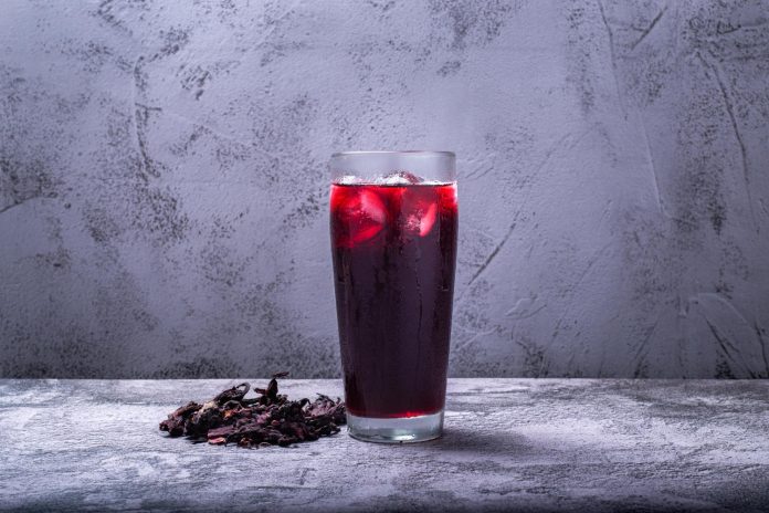 drink prepared with jamaica flower concrete table